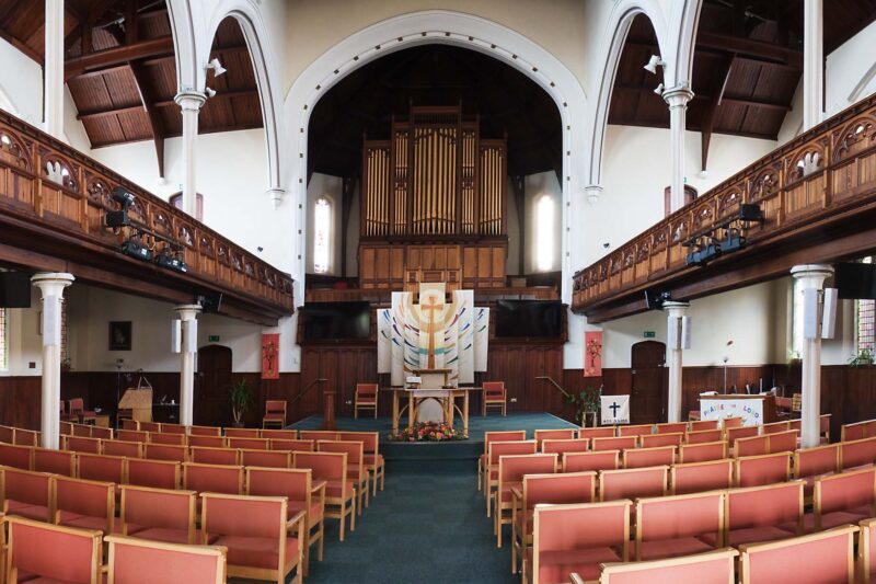 The Worship Centre at Christchurch Clarendon Park Road, Leicester. A view from the back of the church showing the pipework of the organ to the rear of the image.